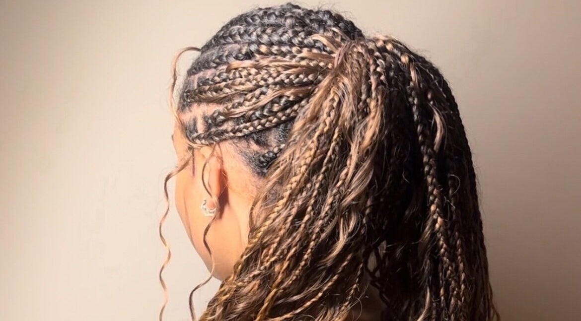 Detailed side view of braided hairstyle at Ney's Braids and Beauty, Kingsteignton, England, GB.