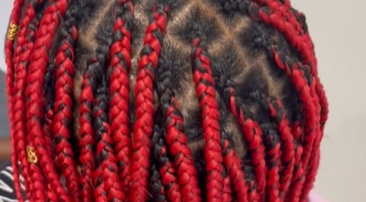 Red and black braids at Ney's Braids and Beauty, Kingsteignton, England, GB.