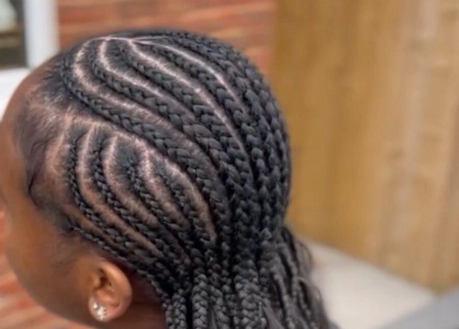 Intricate braiding at Ney's Braids and Beauty, Kingsteignton, England, GB, showcasing expert craftsmanship.