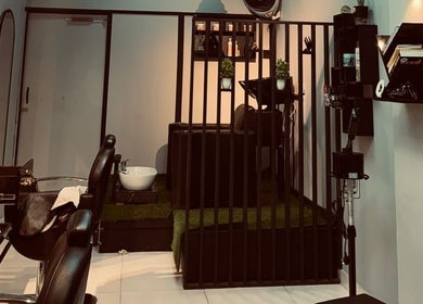 Sophisticated setup at TrimLine Salon in Karachi, Sindh, PK featuring plush chairs and styling stations.