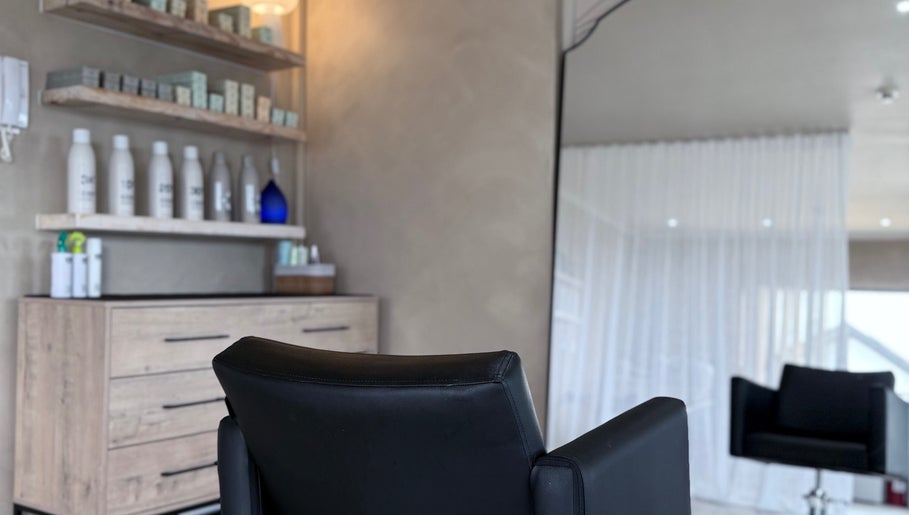 Elegant salon chair and modern decor at Tam’s Chair in Cape Town, Western Cape, ZA.