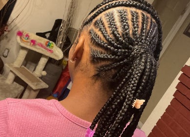 Intricate braided hairstyle at The Loc Lounge in Savannah, Georgia, US, showcasing detailed craftsmanship.