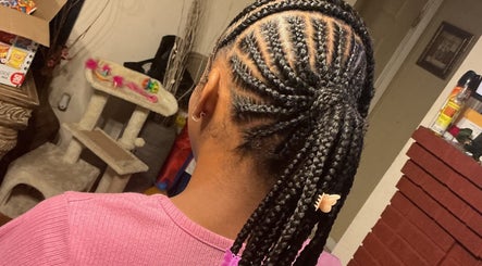 Intricate braided hairstyle at The Loc Lounge in Savannah, Georgia, US, showcasing detailed craftsmanship.