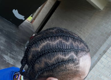 Intricate braids at The Loc Lounge, Savannah, Georgia, US showcasing expert hair styling.