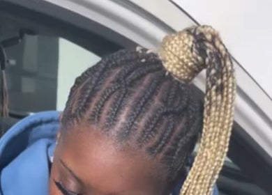 Intricate braided hairstyle at The Loc Lounge in Savannah, Georgia, US, showcasing expert styling.