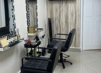 Elegant salon chairs and mirrors at Maia Cosmetics, London, England, GB, showcasing a refined ambiance.