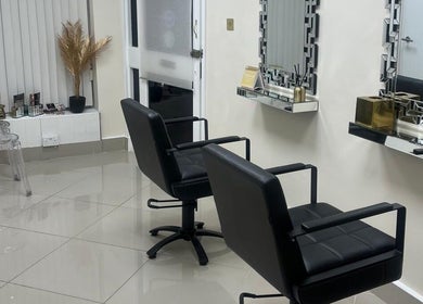 Modern salon chairs and mirrors at Maia Cosmetics in London, England, GB.