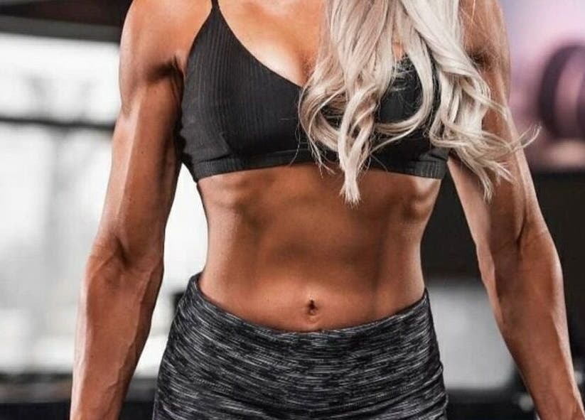 Fit woman exhibiting strength at Michelle Rörich Fitness, Ballito, Kwazulu-natal, ZA gym environment.