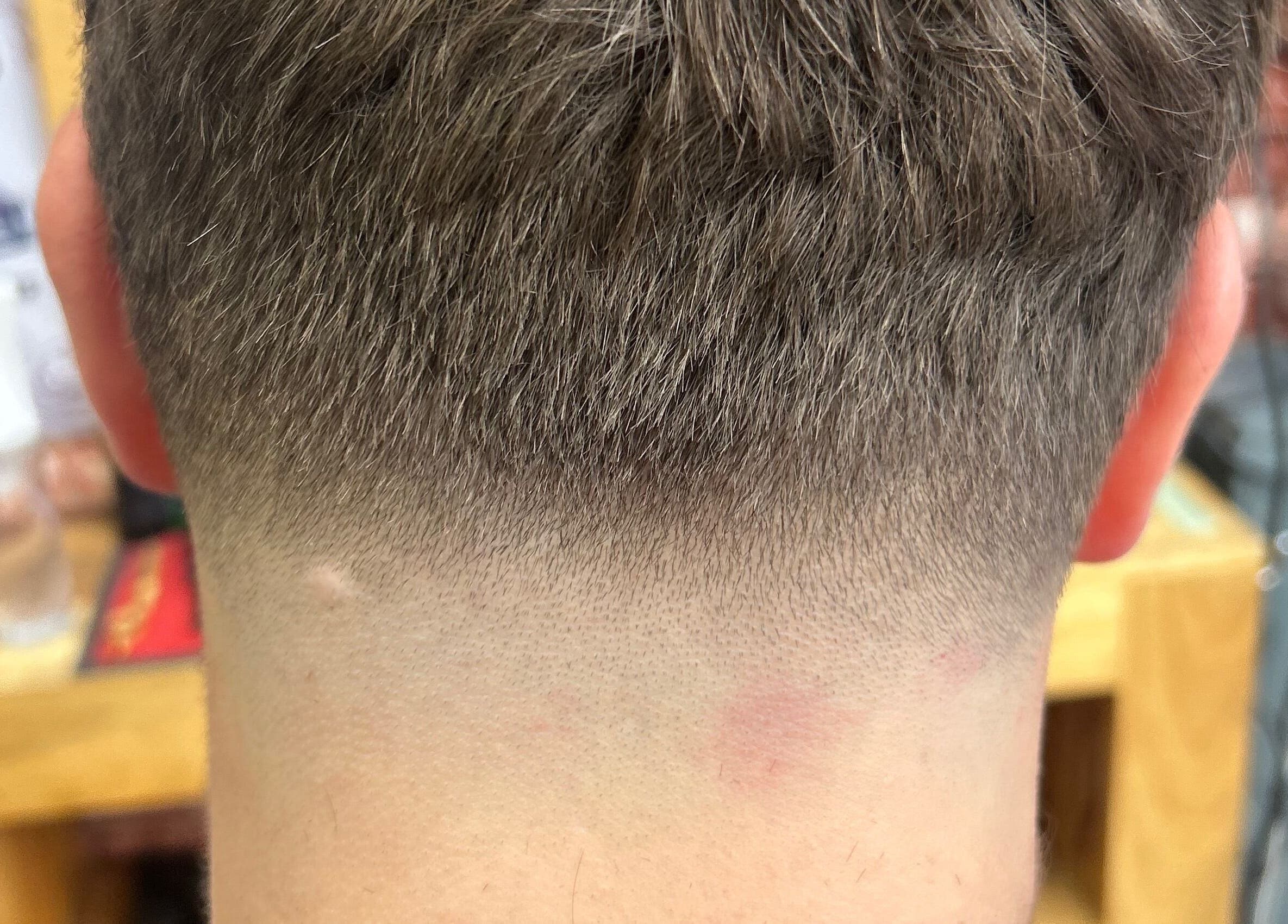 Close-up of a crisp undercut fade hairstyle at WMCuts, Shrewsbury, England, GB.