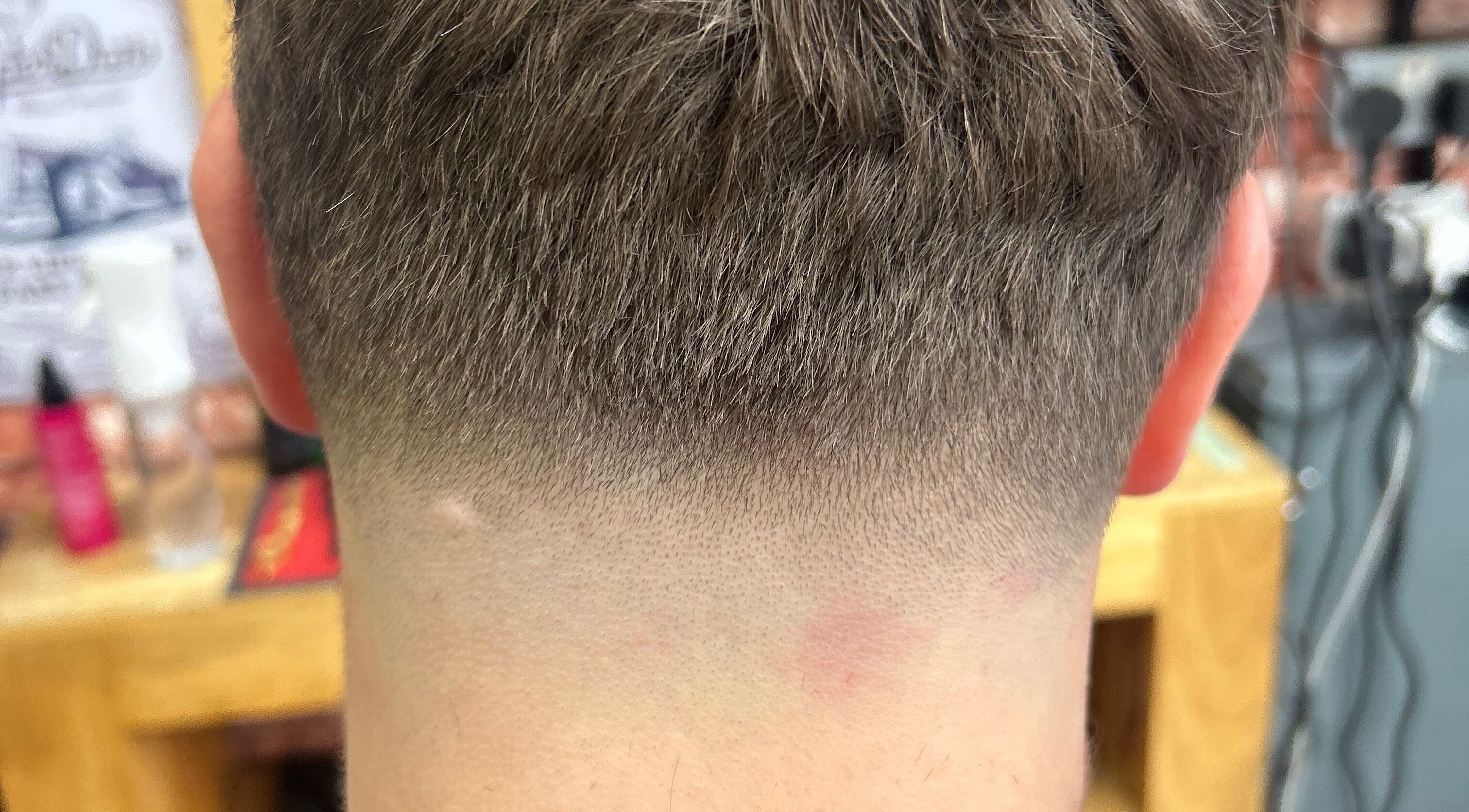 Close-up of a crisp undercut fade hairstyle at WMCuts, Shrewsbury, England, GB.