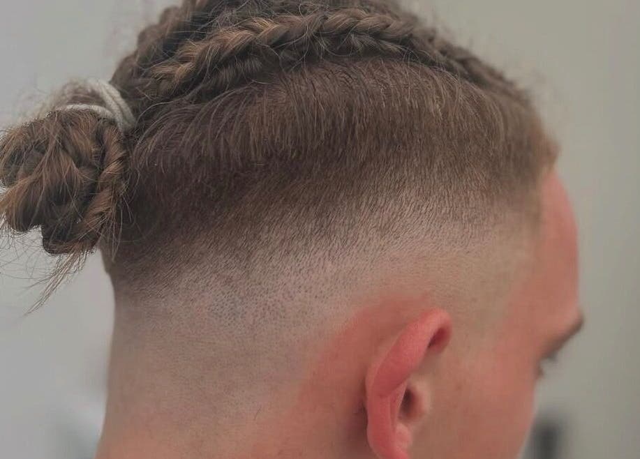 Stylish men's braids and fade at WMCuts, Shrewsbury, England, GB. Perfect for modern looks.