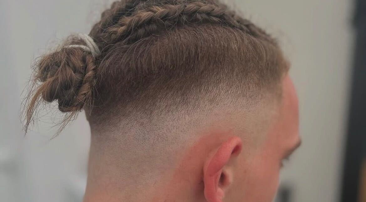 Stylish men's braids and fade at WMCuts, Shrewsbury, England, GB. Perfect for modern looks.