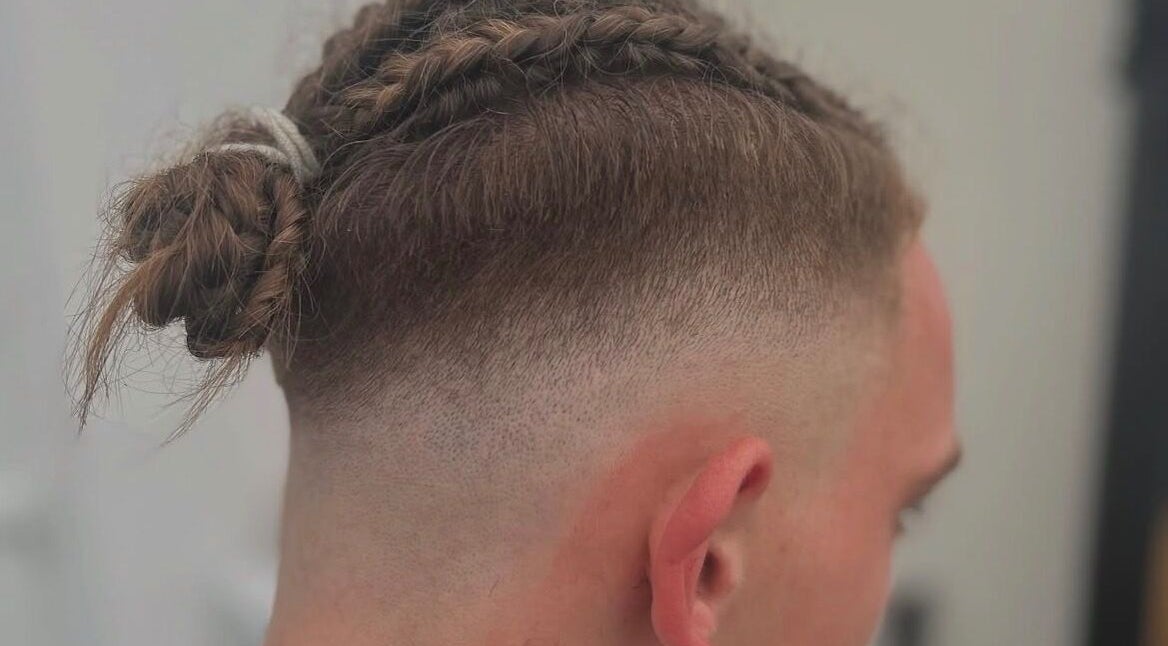 Stylish men's braids and fade at WMCuts, Shrewsbury, England, GB. Perfect for modern looks.