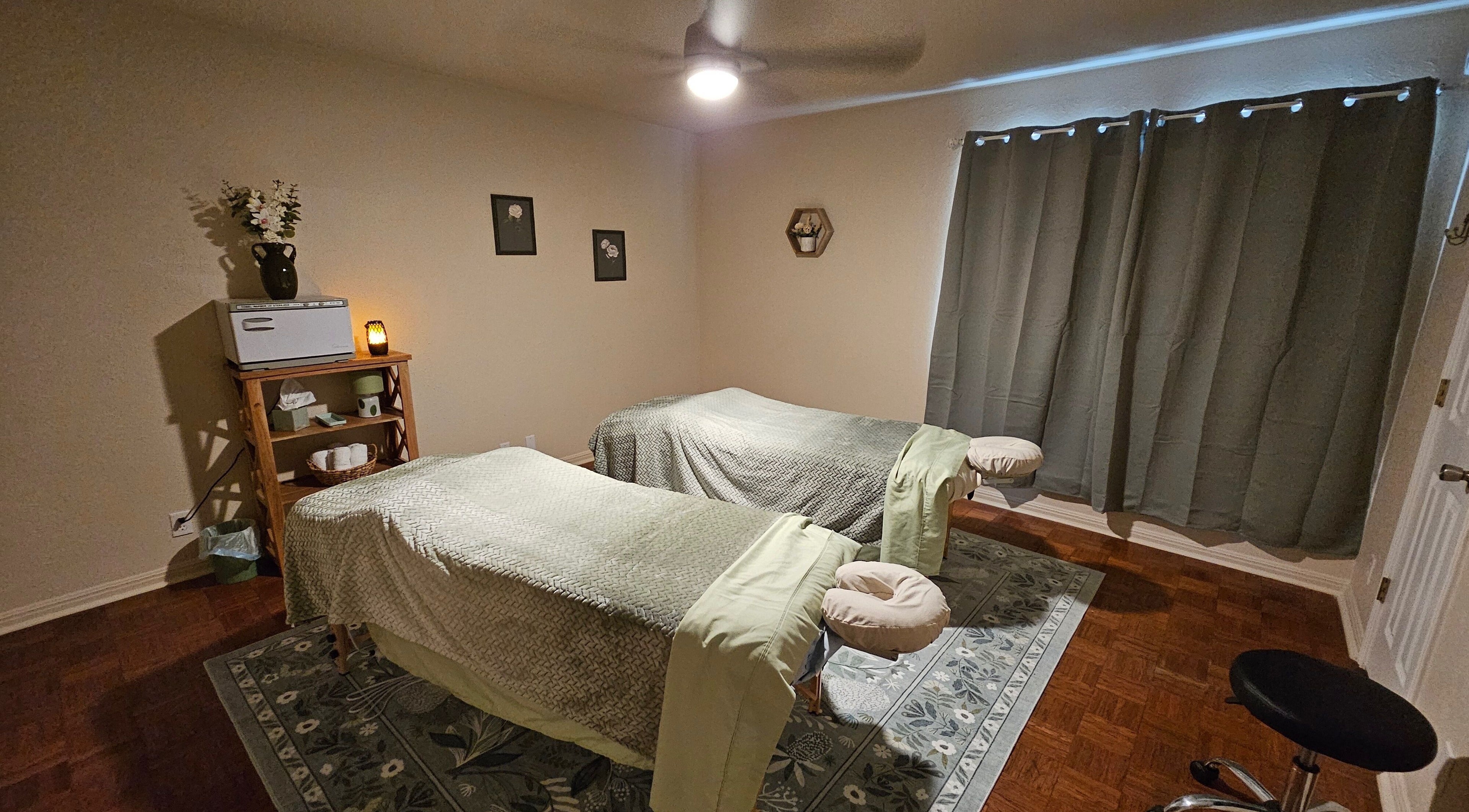 Peaceful massage room at Magic Daughters Skincare & Apothecary, Austin, Texas, US with two massage tables.