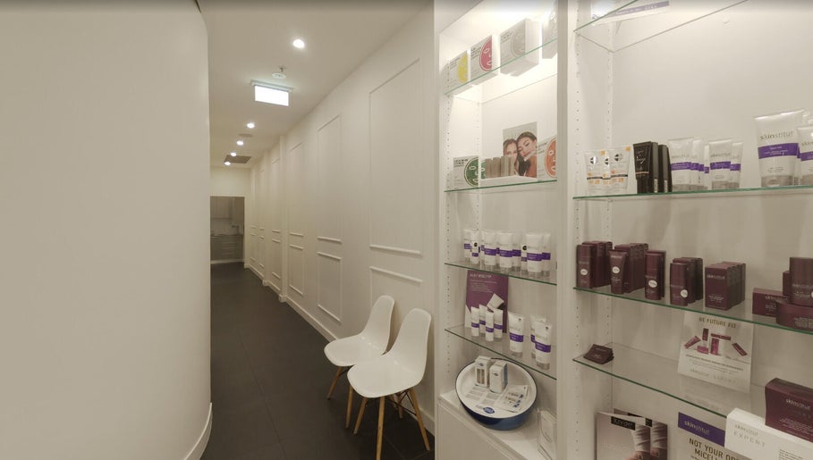Chic corridor with product display at Mouda Laser & Skin Clinic, Wentworthville, New South Wales, AU.