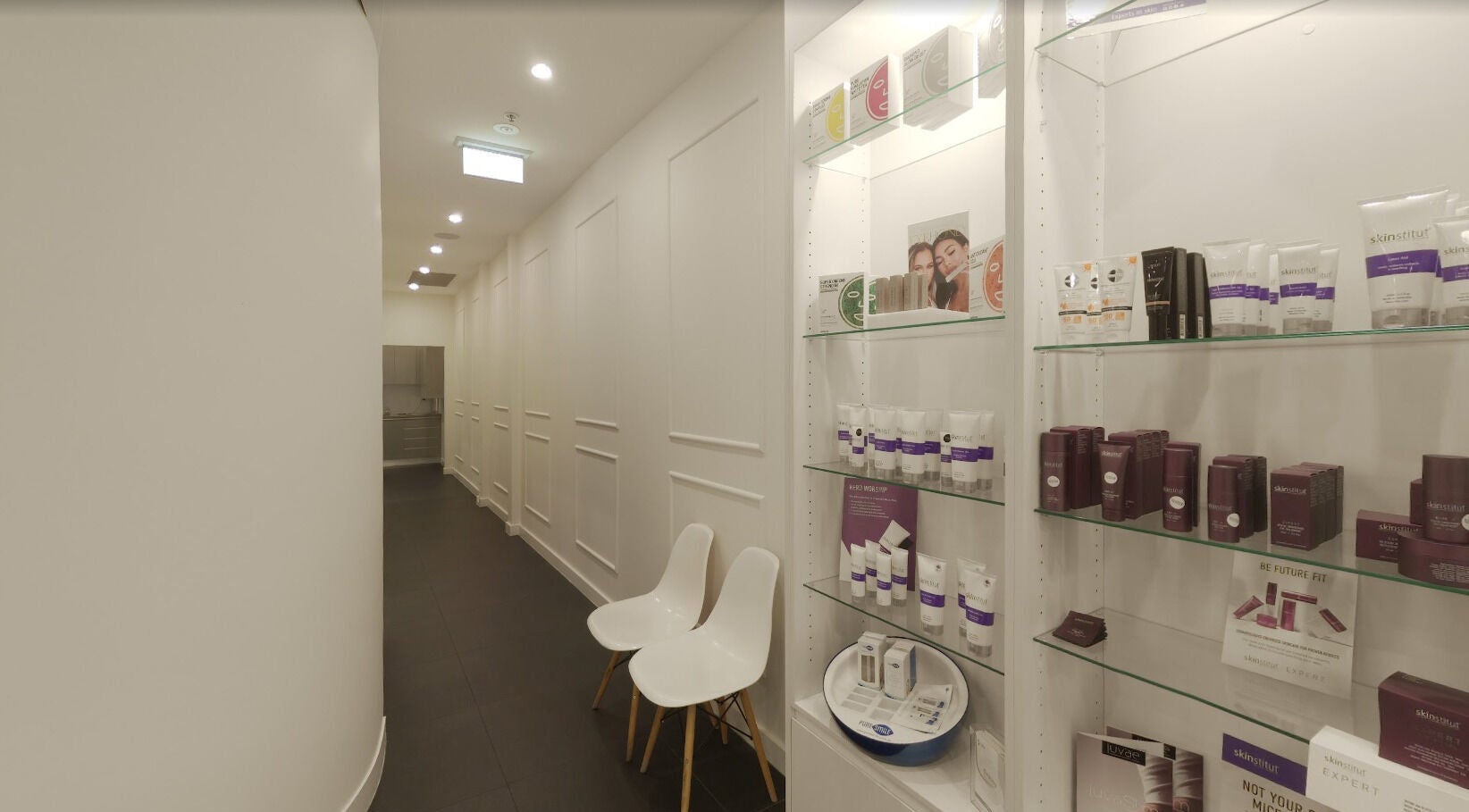 Chic corridor with product display at Mouda Laser & Skin Clinic, Wentworthville, New South Wales, AU.