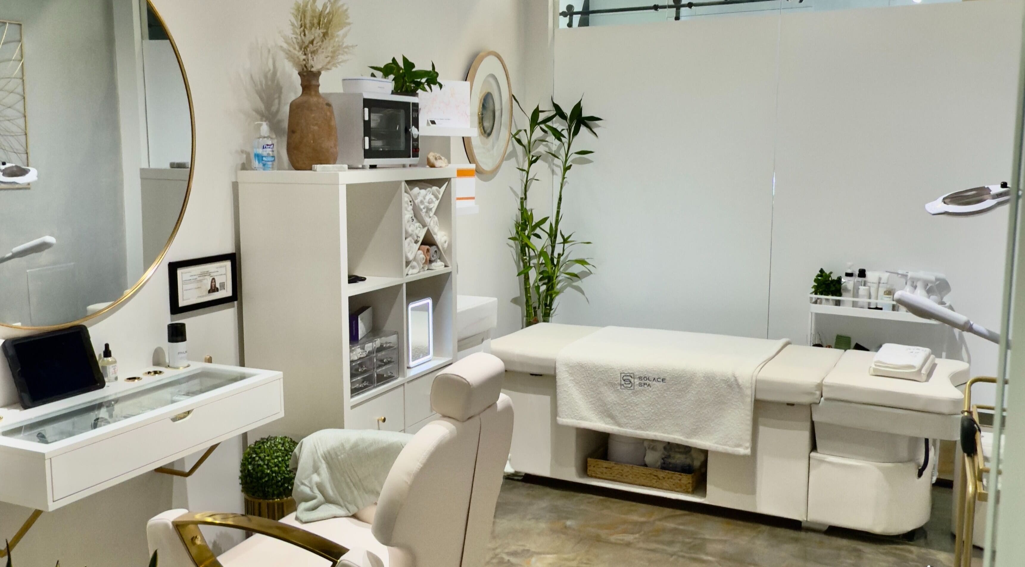 Modern spa room at Solace Spa, Miami, Florida, US, featuring sleek decor and treatment table.