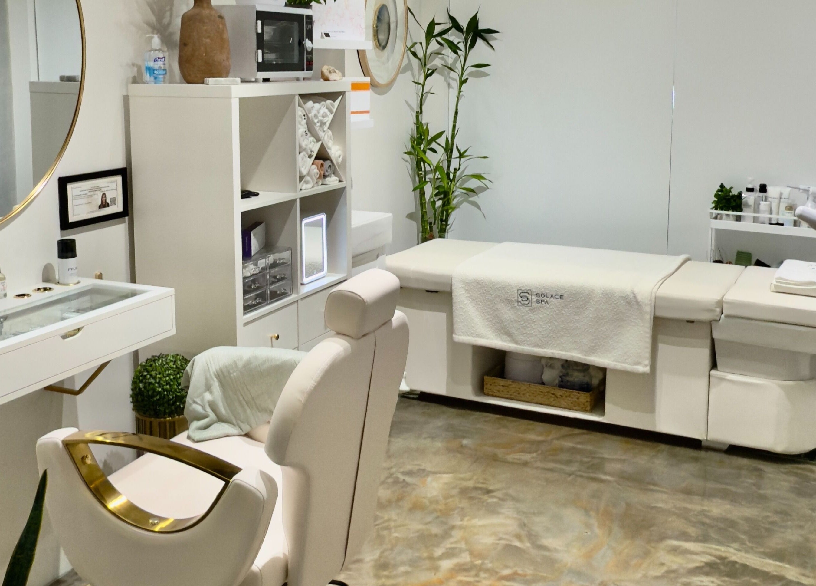 Luxurious treatment room at Solace Spa, Miami, Florida, US featuring a massage table and soothing decor.
