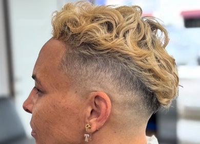 Side view of a blonde fade haircut at Chilly.Da.Barber of FAMA Cuts, Los Angeles, California, US.