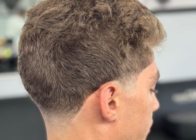 Stylish fade haircut at Chilly.Da.Barber(of FAMA Cuts), Los Angeles, California, US.
