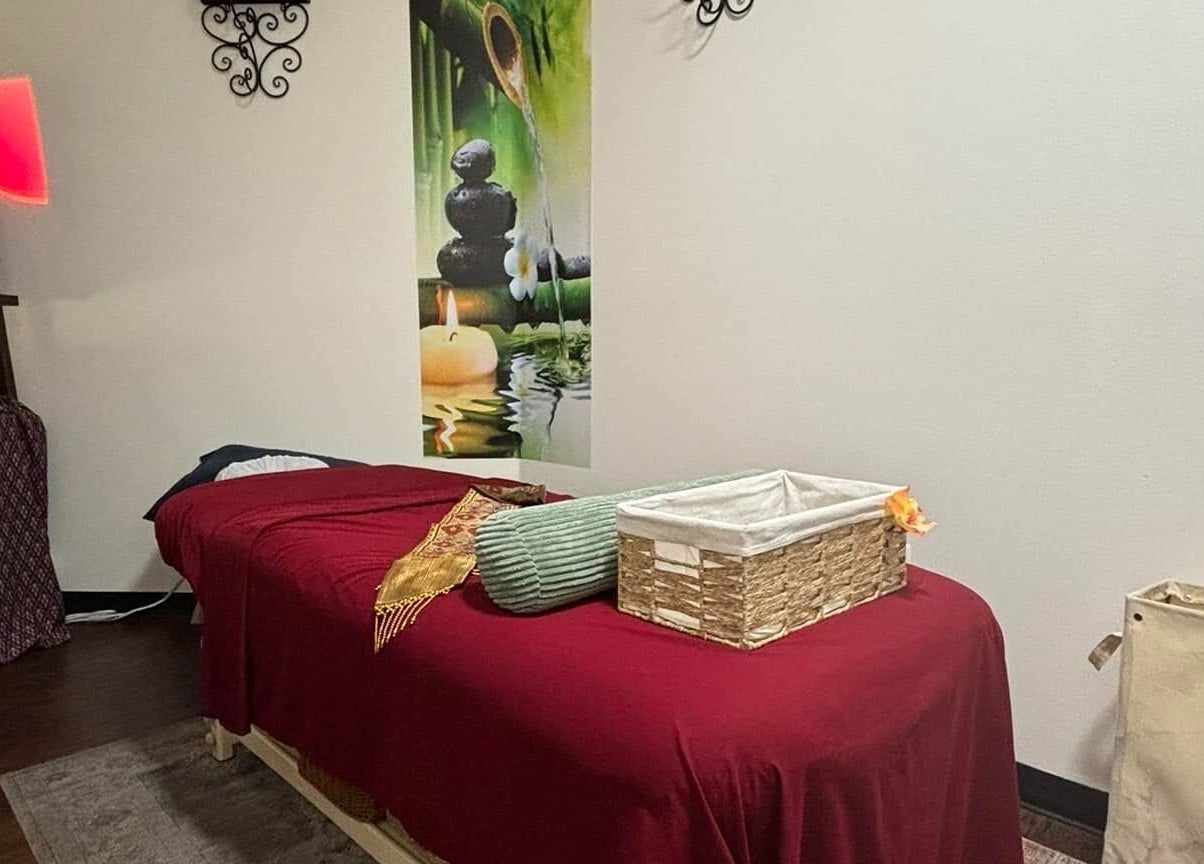 Peaceful massage room at Creative Spa & Az Siam Thai Massage in Scottsdale, Arizona, US with red decor.