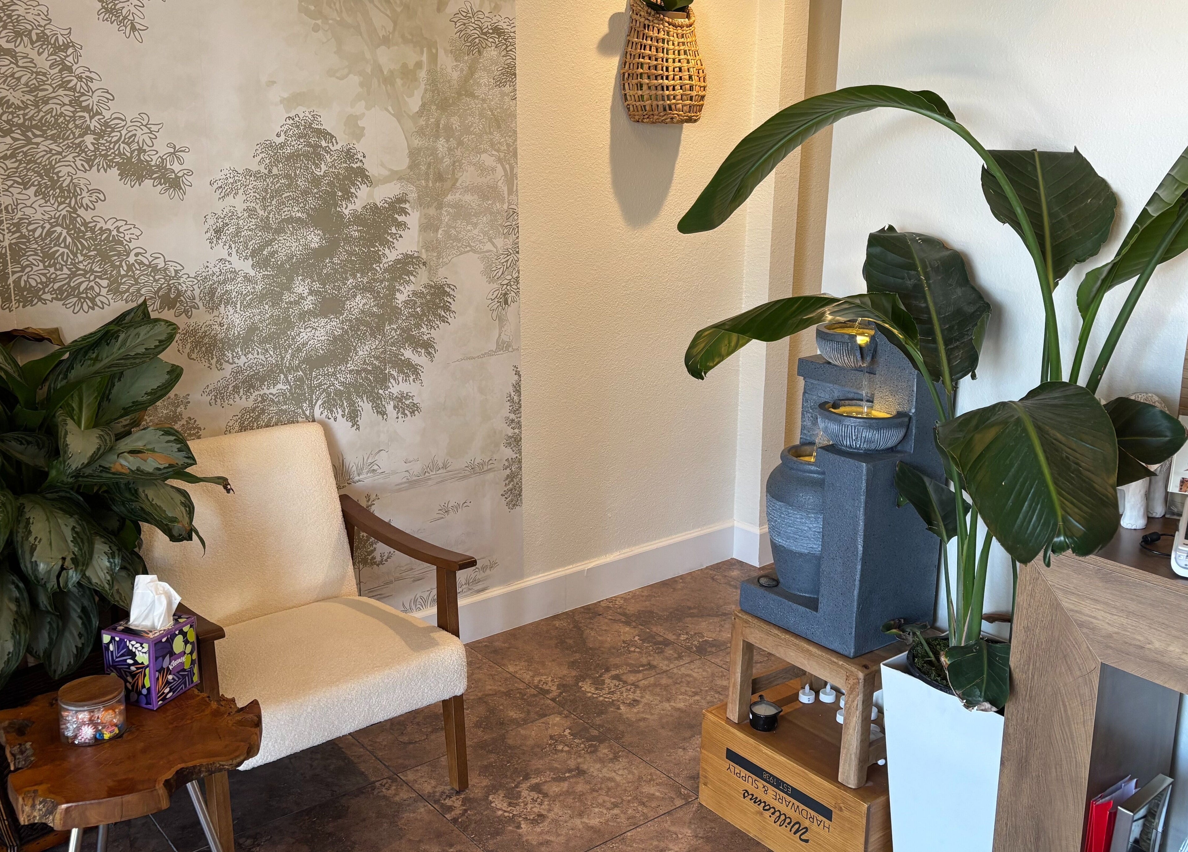 Cozy seating with lush plants at Creative Spa & Az Siam Thai Massage, Scottsdale, Arizona, US.