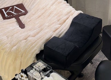 Cozy treatment bed and tools at Kaya Artistry in Condell Park, New South Wales, AU, showcasing comfort and care.