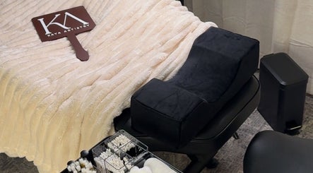 Cozy treatment bed and tools at Kaya Artistry in Condell Park, New South Wales, AU, showcasing comfort and care.