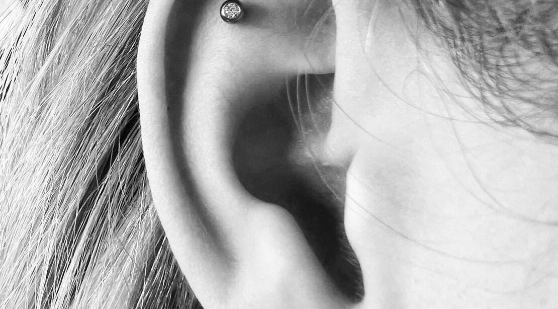 Elegant ear piercing with a sparkling gem at Thy Eternal, Hayle, England, GB.