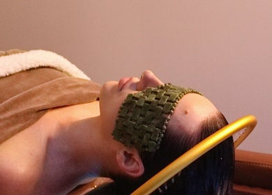 Relaxing treatment at Oula Head Spa, Brisbane, Queensland, AU. Client with a calming mask.
