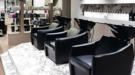 Mister and Her salon with sleek shampoo chairs in Bowden, South Australia, AU.