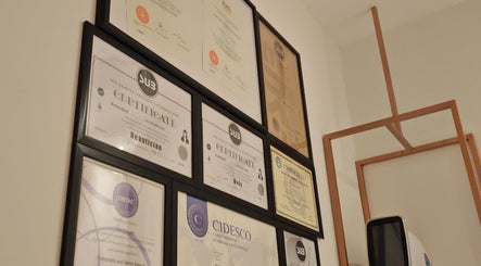 Certification display at Yuan Essence Skin Hub, Puchong, Selangor, MY, showcasing expert credentials.