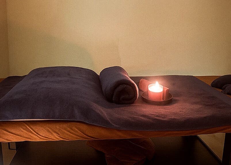 Serene massage table setup with candle at Massage Legendary, Taigum, Queensland, AU.