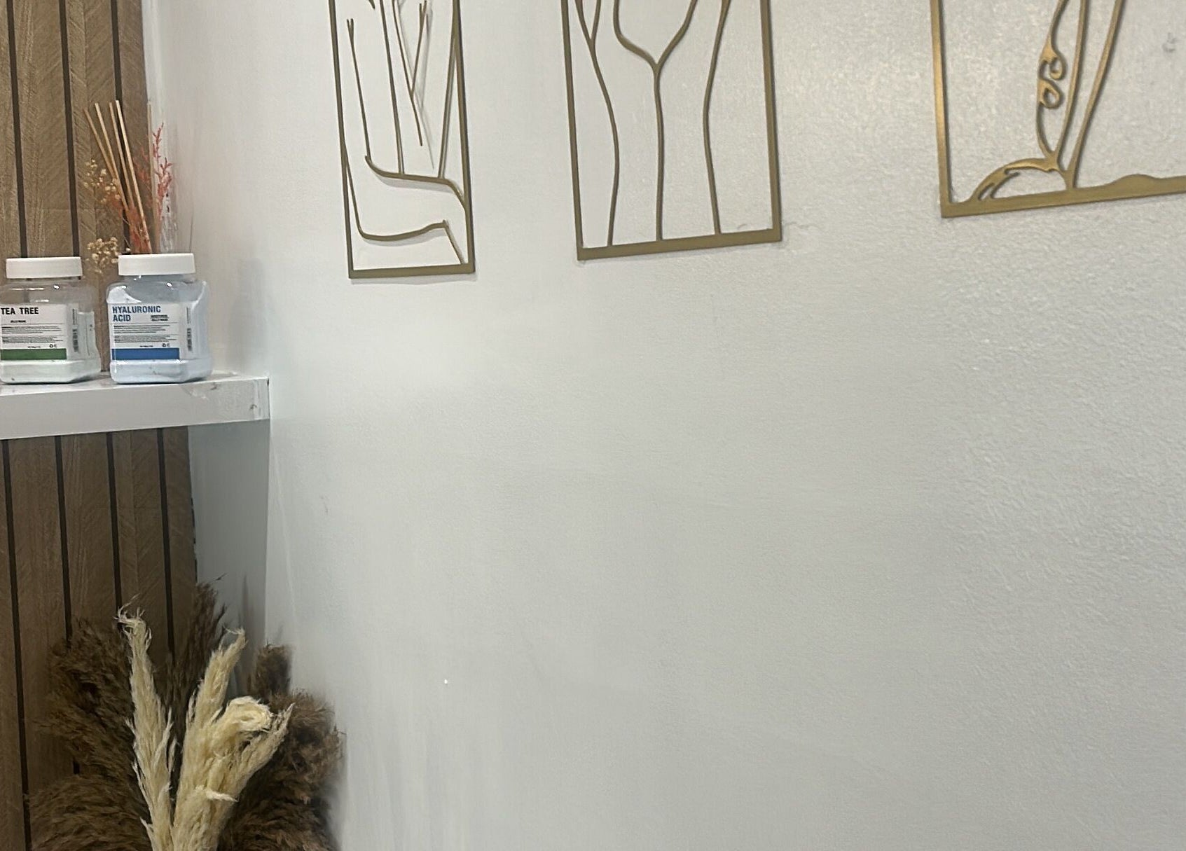 Stylish shelf with beauty jars and art at Sculptmebyjord, Ilford, England, GB.