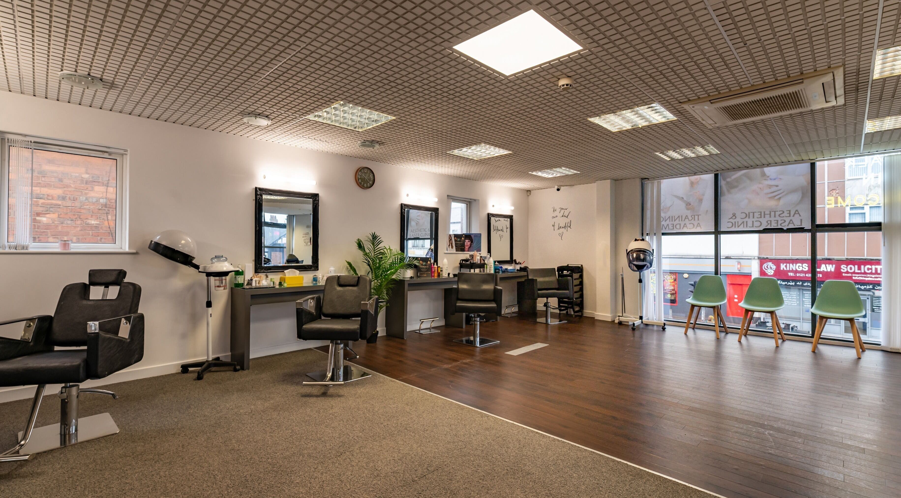 Interior of Shingaar Hair-Beauty & Training Academy in Birmingham, England, GB with modern salon chairs and mirrors.