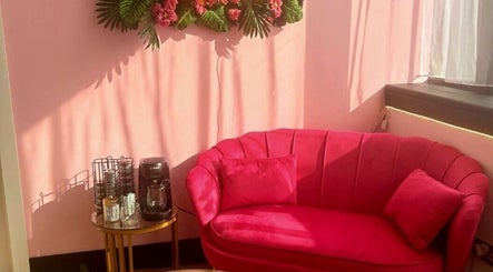 Chic pink sofa and coffee station at Nailed It Sis, Stafford, England, GB, creating a welcoming ambiance.