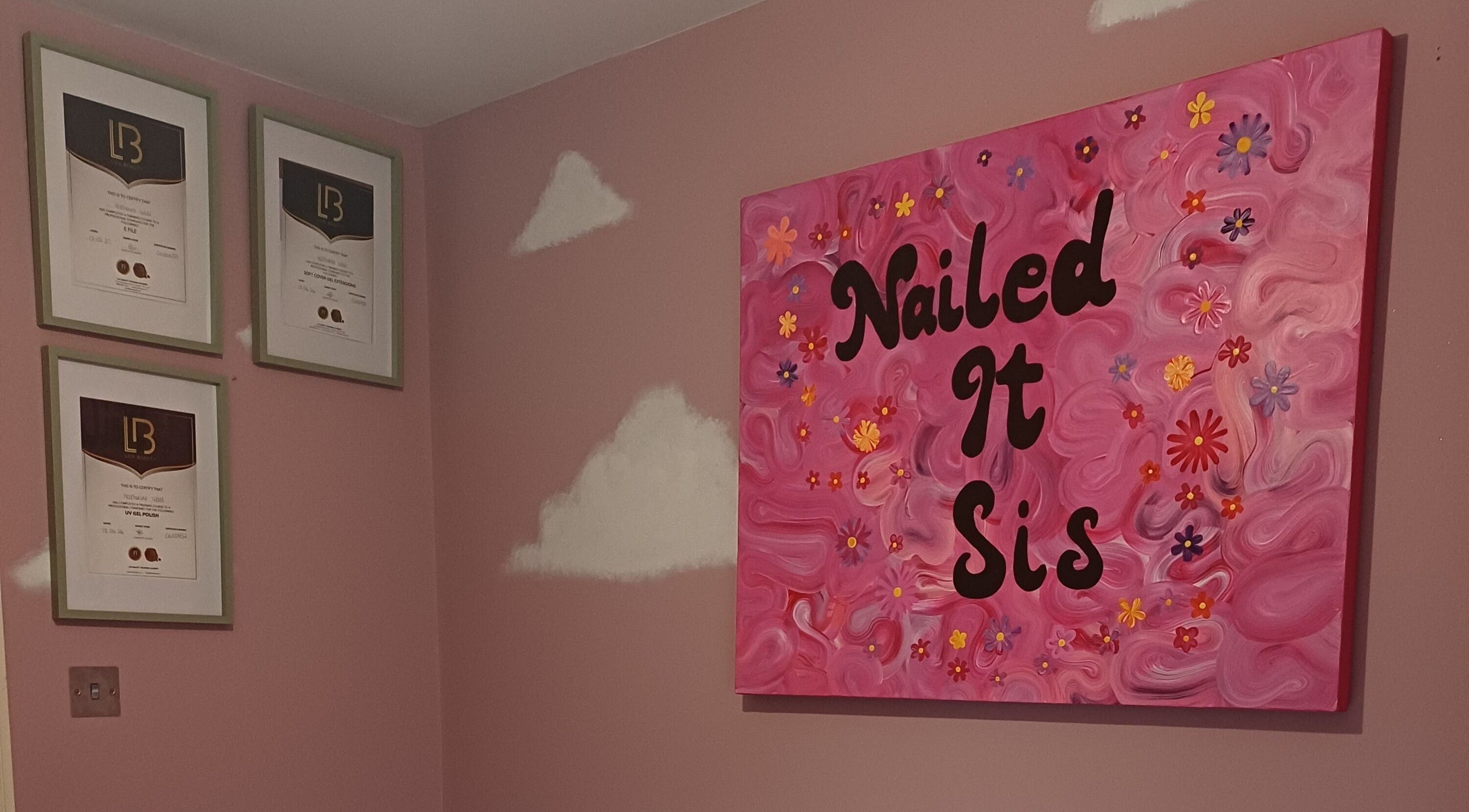 Colorful Nailed It Sis wall art and certificates in Stafford, England, GB beauty venue.