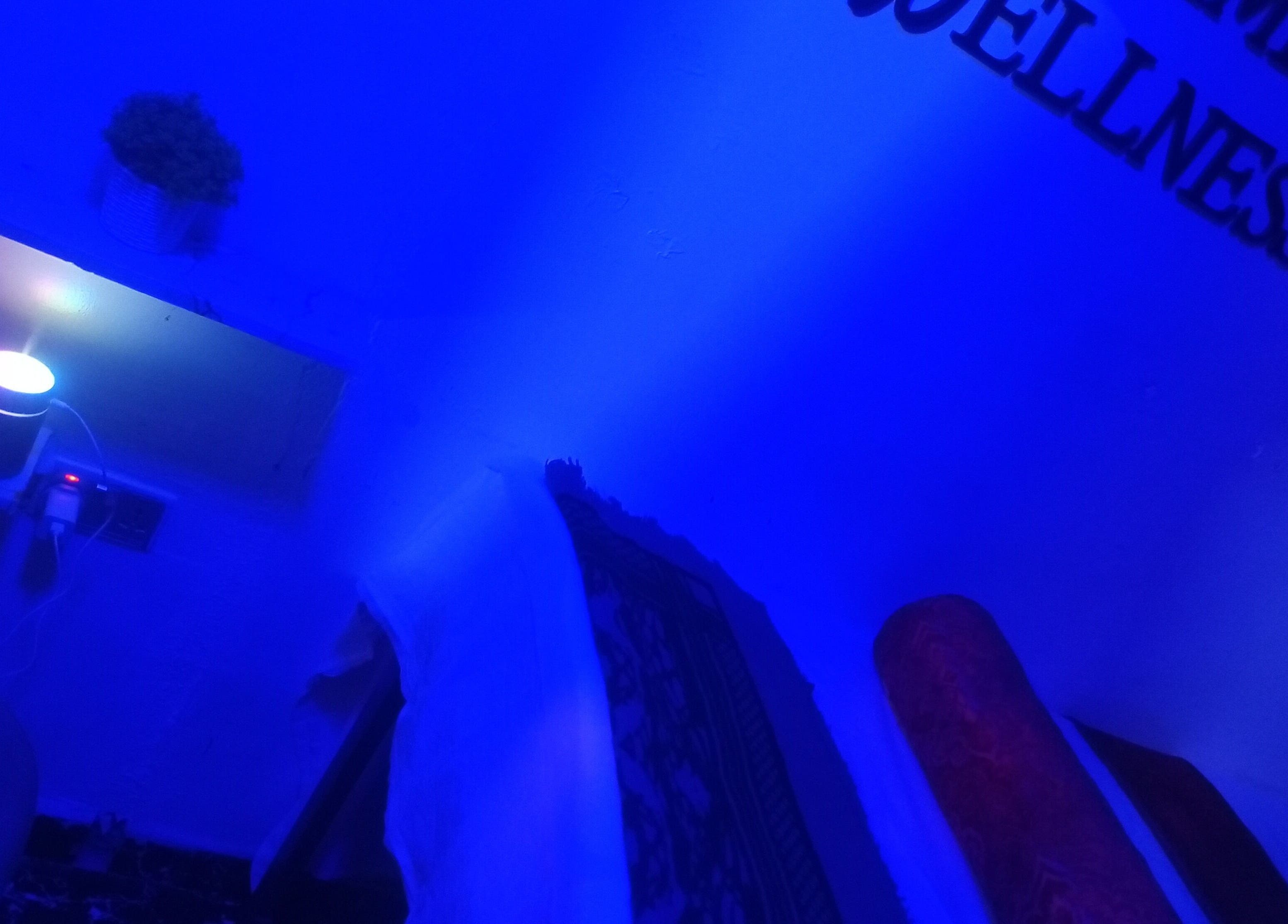 Relaxing blue-lit room at Damme's Wellness, Lagos, Lagos, NG. Experience serene ambiance and rejuvenation.