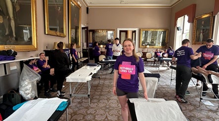 ES Sports Massage event in Ivinghoe, England, GB with team preparing massage tables.