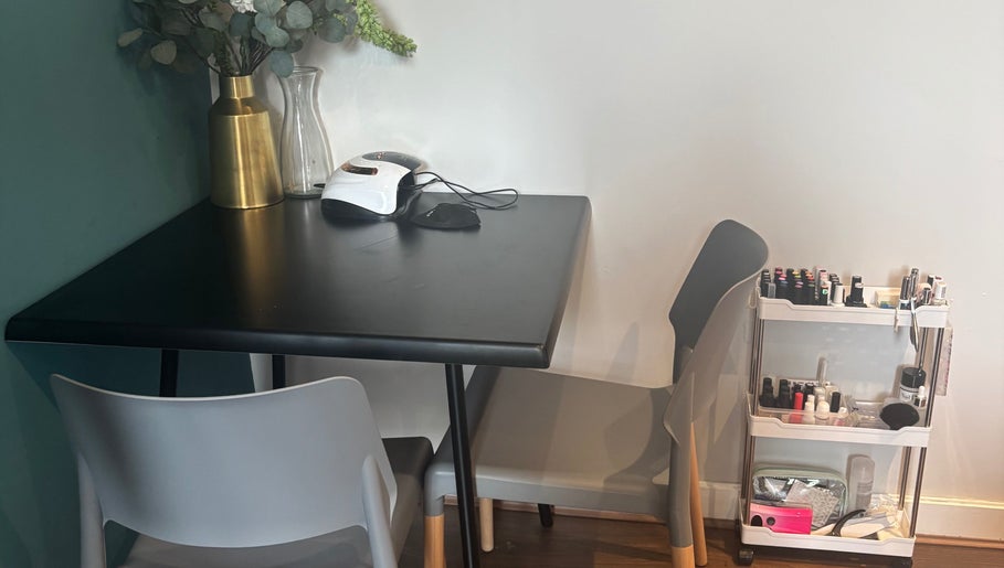 Chic nail station at Nailed By Amii, Leeds, England, GB with nail polishes and manicure tools.