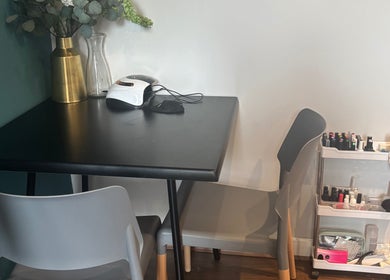 Chic nail station at Nailed By Amii, Leeds, England, GB with nail polishes and manicure tools.
