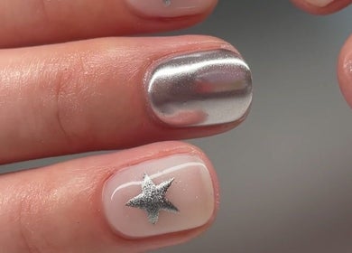 Elegant chrome and star nail design at Nailed By Amii in Leeds, England, GB for a chic style statement.