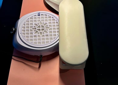 Professional nail station at Nailed By Amii in Leeds, England, GB, featuring tools and cushions.