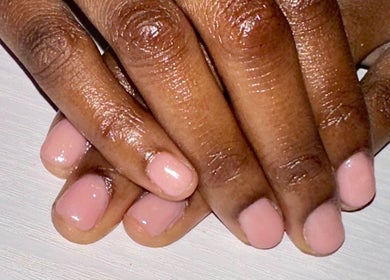 Beautifully manicured nails at Nailed By Amii, Leeds, England, GB showcasing a glossy pink finish.