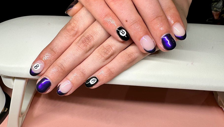 Purple and black nail art at Nailed By Amii in Leeds, England, GB, featuring a stylish 8-ball design.