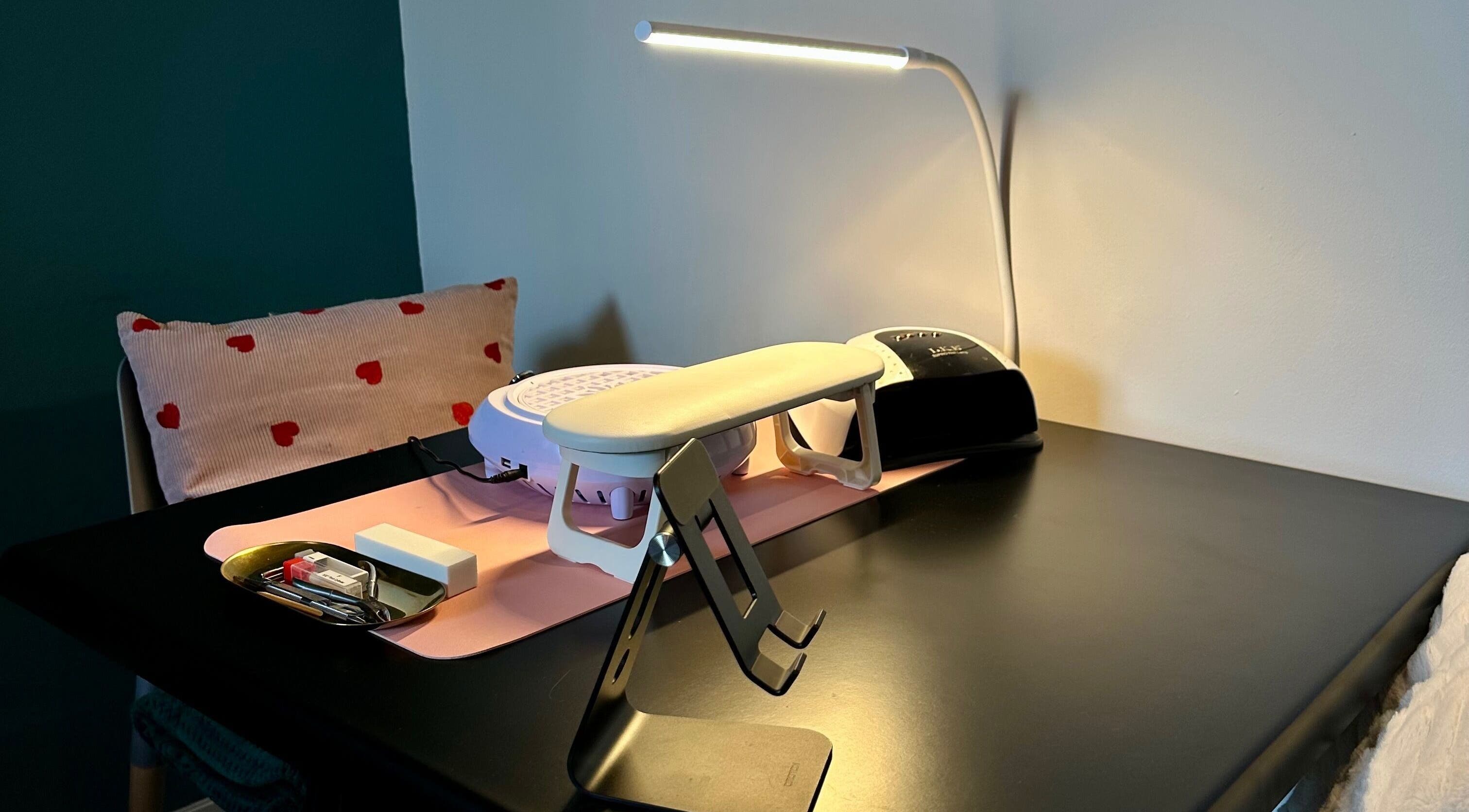 Nail station setup at Nailed By Amii, Leeds, England, GB featuring tools and a comfy chair.