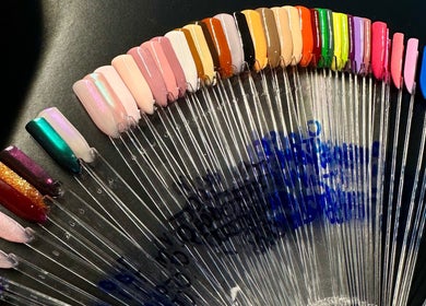 Nail polish display at Nailed By Amii, Leeds, England, GB, showcasing vibrant color options.