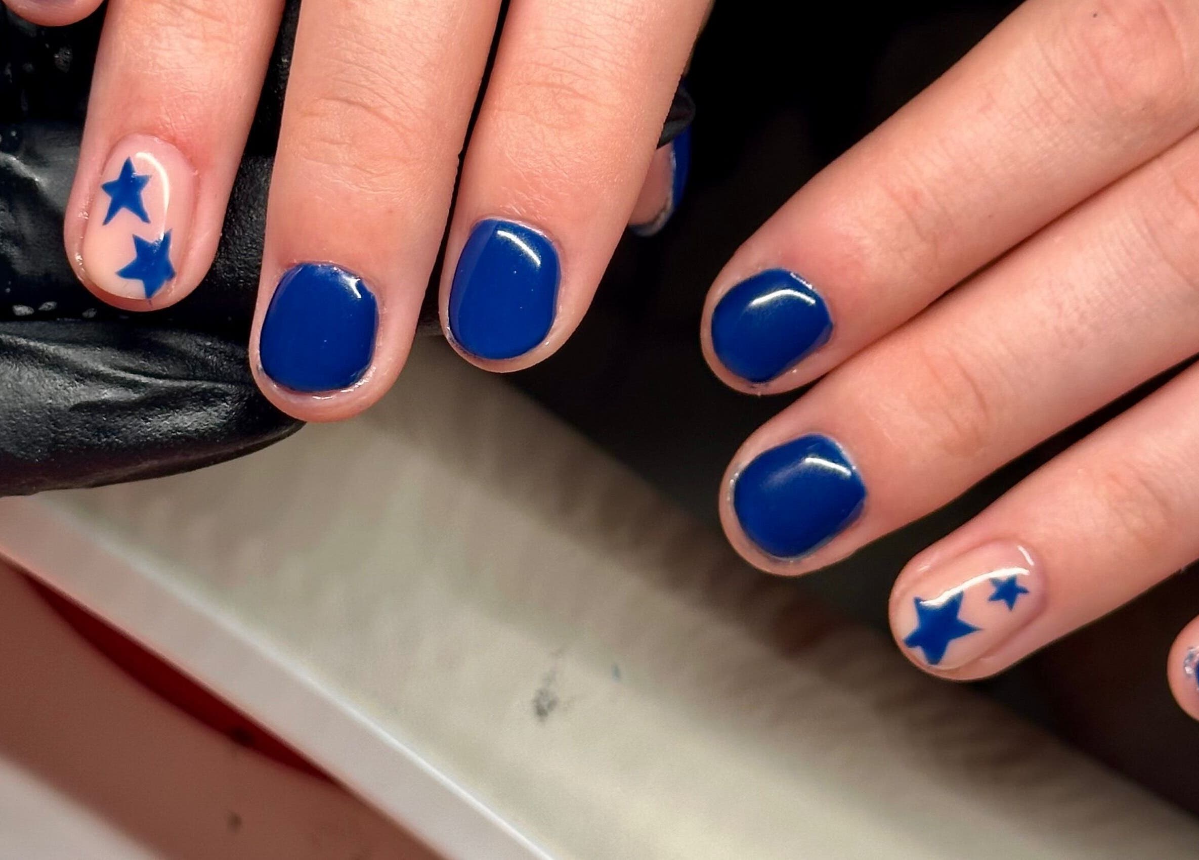 Blue star nail art at Nailed By Amii, Leeds, England, GB. Chic and elegant manicure style.