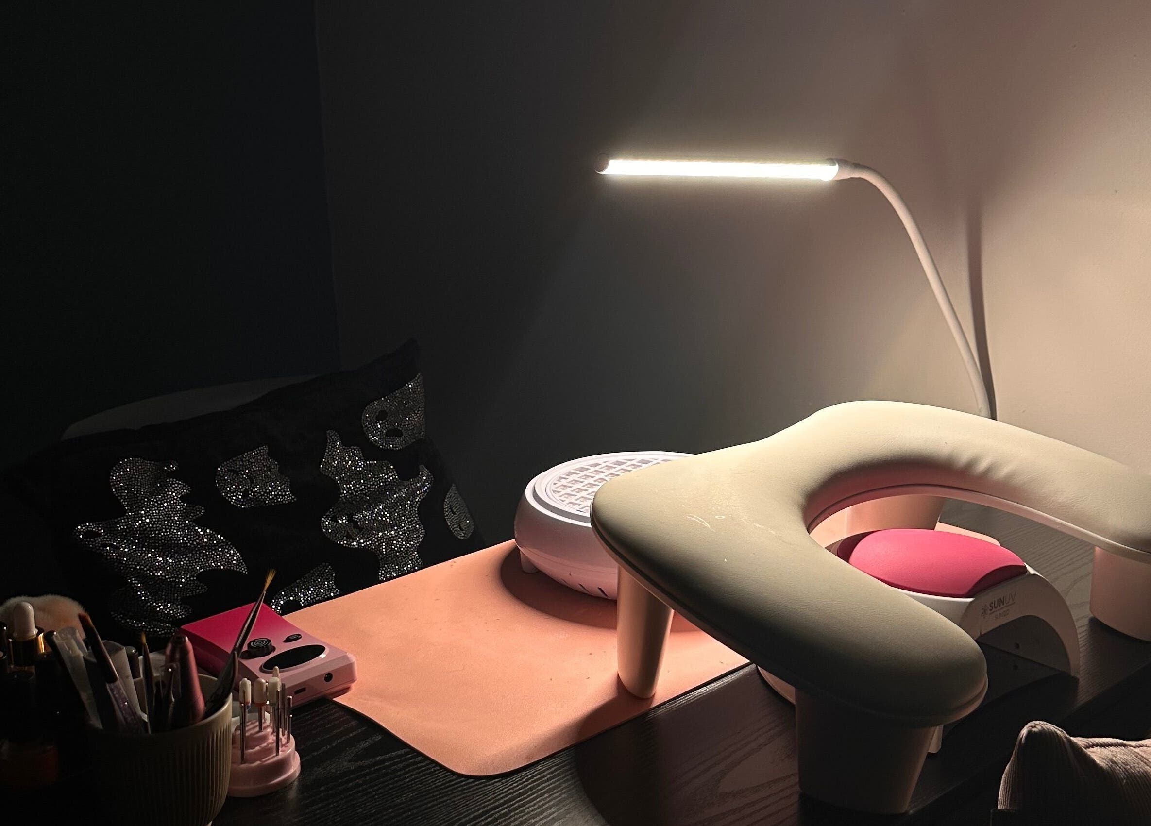 Elegant nail station at Nailed By Amii in Leeds, England, GB, showcasing manicure tools and lighting.