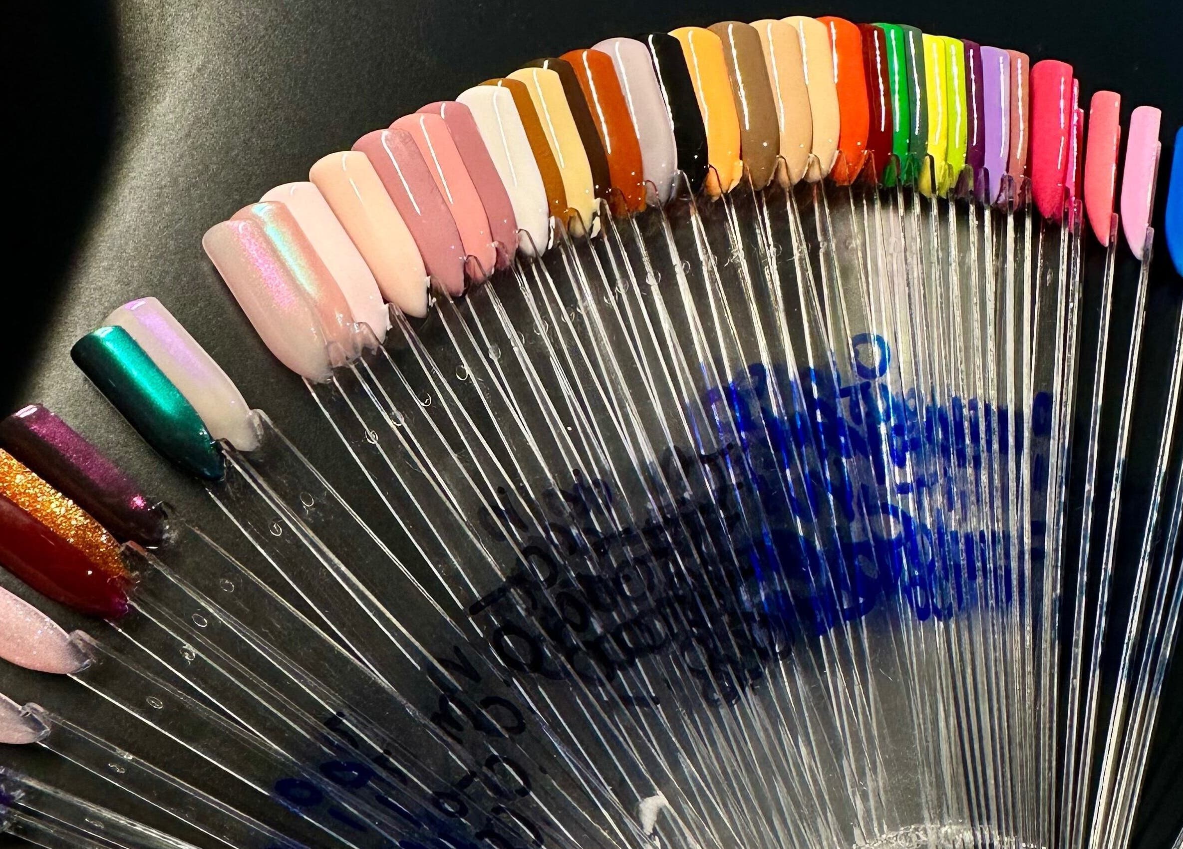 Colorful nail polish swatches at Nailed By Amii, Leeds, England, GB showcasing vibrant manicure options.